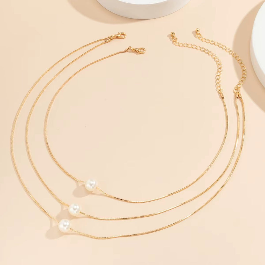 Lunara™ Boho Pearl Clavicle Necklace – Effortless Glow, Timeless GraceWhere Minimalism Meets Modern Boho CharmThe Lunara™ Boho Pearl Clavicle Necklace is a radiant blend of simplicity and sophistication. Featuring a delicate round snakRemoloxLunara™ Boho Pearl Clavicle Necklace