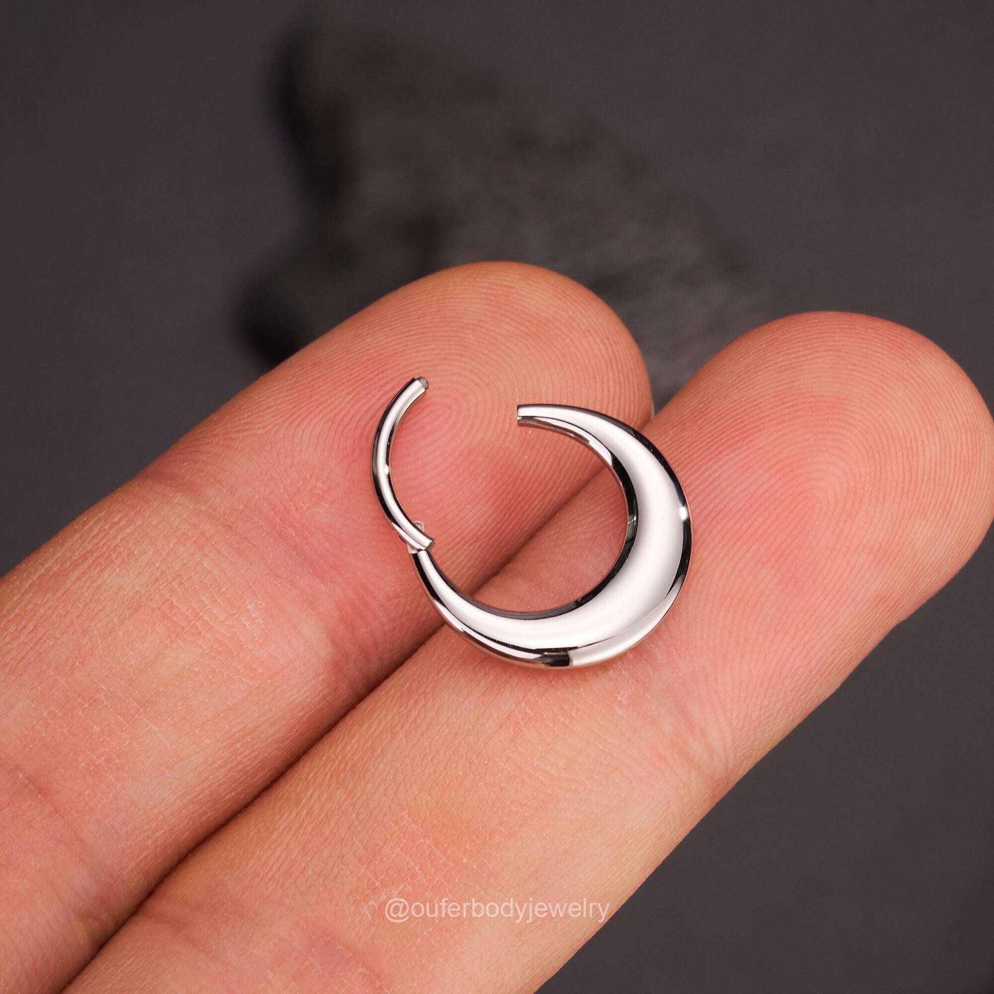 Lunar Bold Septum Clicker – Sculpted Shine for Unapologetic StyleA Statement of Strength, Styled with PrecisionThe Lunar Bold Septum Clicker is the perfect fusion of edgy attitude and refined design. Crafted from premium surgical RemoloxLunar Bold Septum Clicker