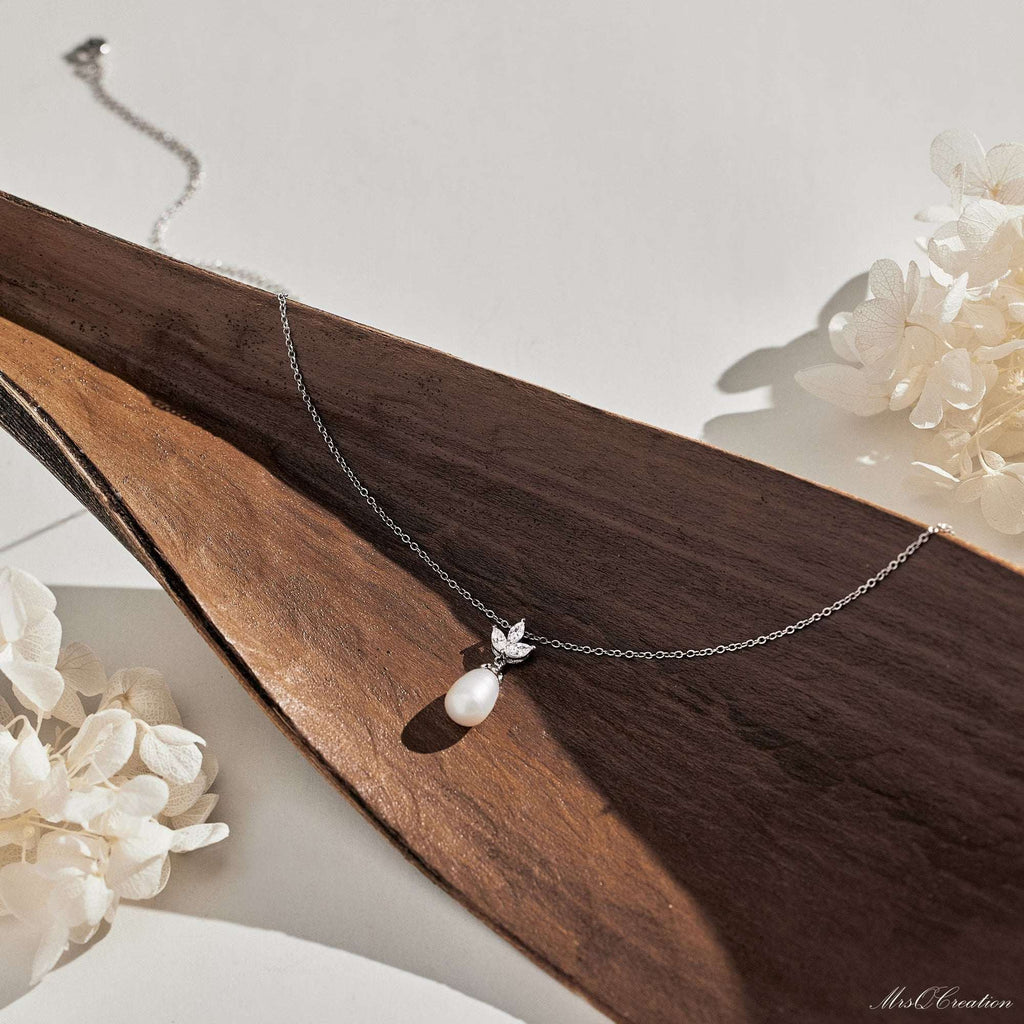 Eternal Pearl & Diamond Necklace – A Whisper of Elegance for Life’s MoGrace Woven in Crystal and PearlThe Eternal Pearl &amp; Diamond Necklace is where timeless beauty meets bridal elegance. Crafted in luminous sterling silver, it featRemoloxEternal Pearl & Diamond Necklace