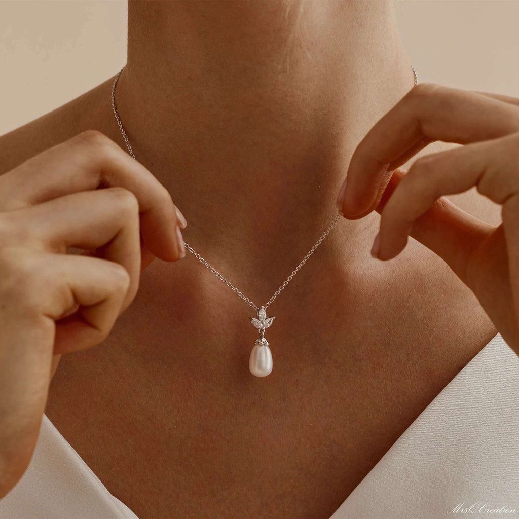 Eternal Pearl & Diamond Necklace – A Whisper of Elegance for Life’s MoGrace Woven in Crystal and PearlThe Eternal Pearl &amp; Diamond Necklace is where timeless beauty meets bridal elegance. Crafted in luminous sterling silver, it featRemoloxEternal Pearl & Diamond Necklace