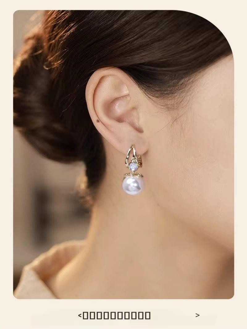 Pearl Earrings Copper Alloy Red Diamond Earrings Fashionable TemperameRadiate Grace with Every TurnThe ScarletLuxe™ Pearl &amp; Red Crystal Drop Earrings are a dazzling expression of classic charm and contemporary sophistication. CraftRemoloxPearl Earrings