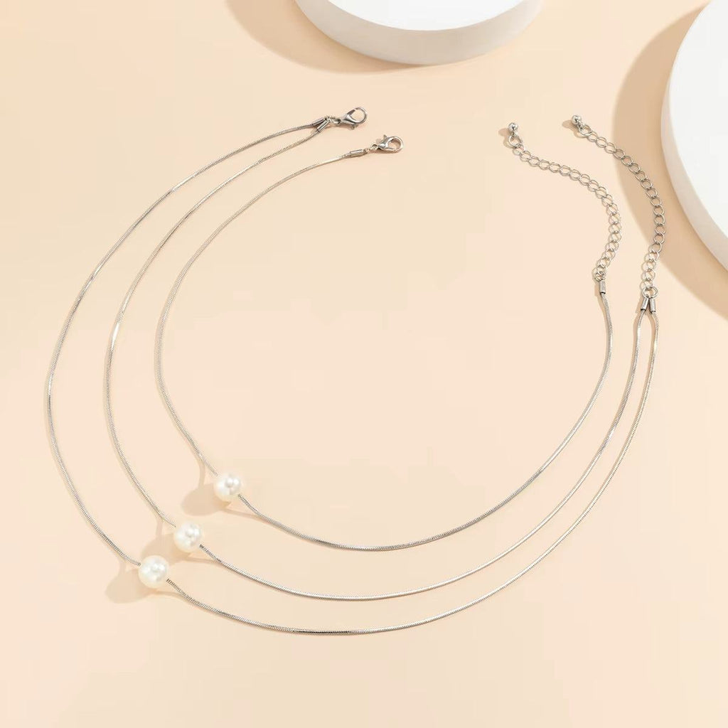 Lunara™ Boho Pearl Clavicle Necklace – Effortless Glow, Timeless GraceWhere Minimalism Meets Modern Boho CharmThe Lunara™ Boho Pearl Clavicle Necklace is a radiant blend of simplicity and sophistication. Featuring a delicate round snakRemoloxLunara™ Boho Pearl Clavicle Necklace