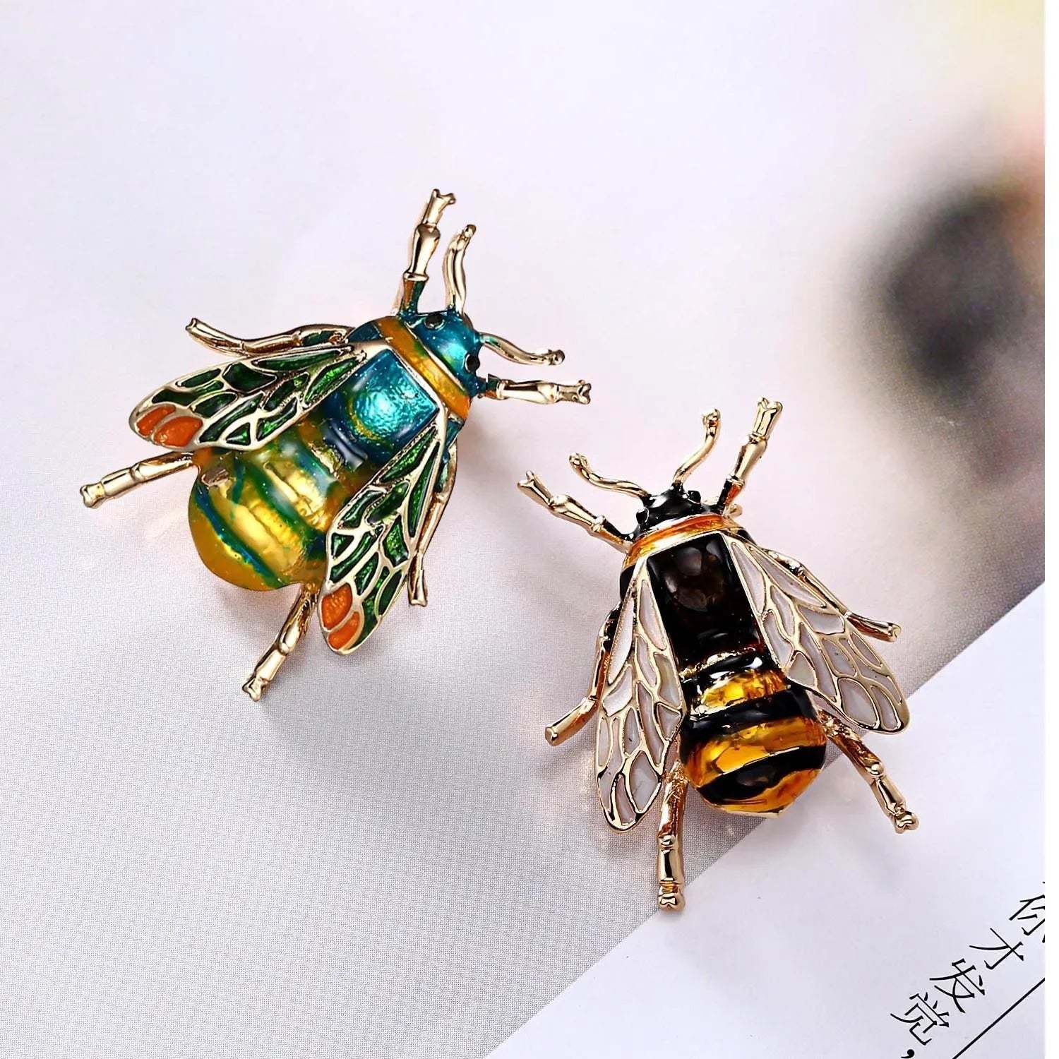 Golden Bee Crystal Brooch with sparkling rhinestones and golden finish on white background