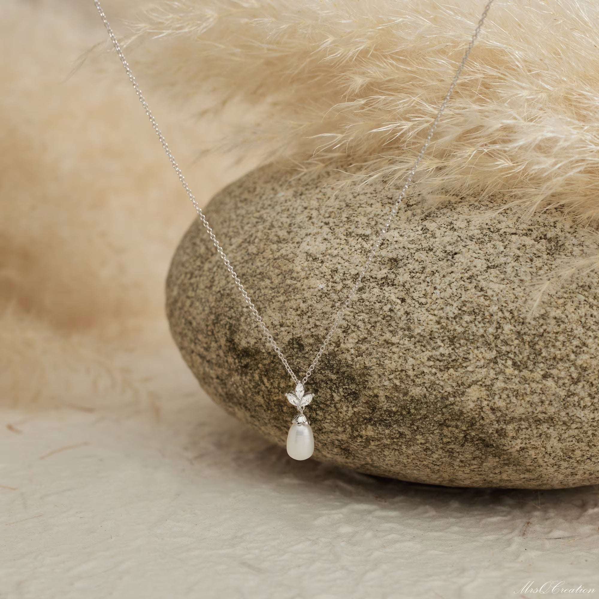 Eternal Pearl & Diamond Necklace – A Whisper of Elegance for Life’s MoGrace Woven in Crystal and PearlThe Eternal Pearl &amp; Diamond Necklace is where timeless beauty meets bridal elegance. Crafted in luminous sterling silver, it featRemoloxEternal Pearl & Diamond Necklace