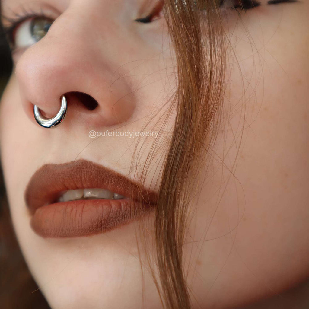 Lunar Bold Septum Clicker – Sculpted Shine for Unapologetic StyleA Statement of Strength, Styled with PrecisionThe Lunar Bold Septum Clicker is the perfect fusion of edgy attitude and refined design. Crafted from premium surgical RemoloxLunar Bold Septum Clicker