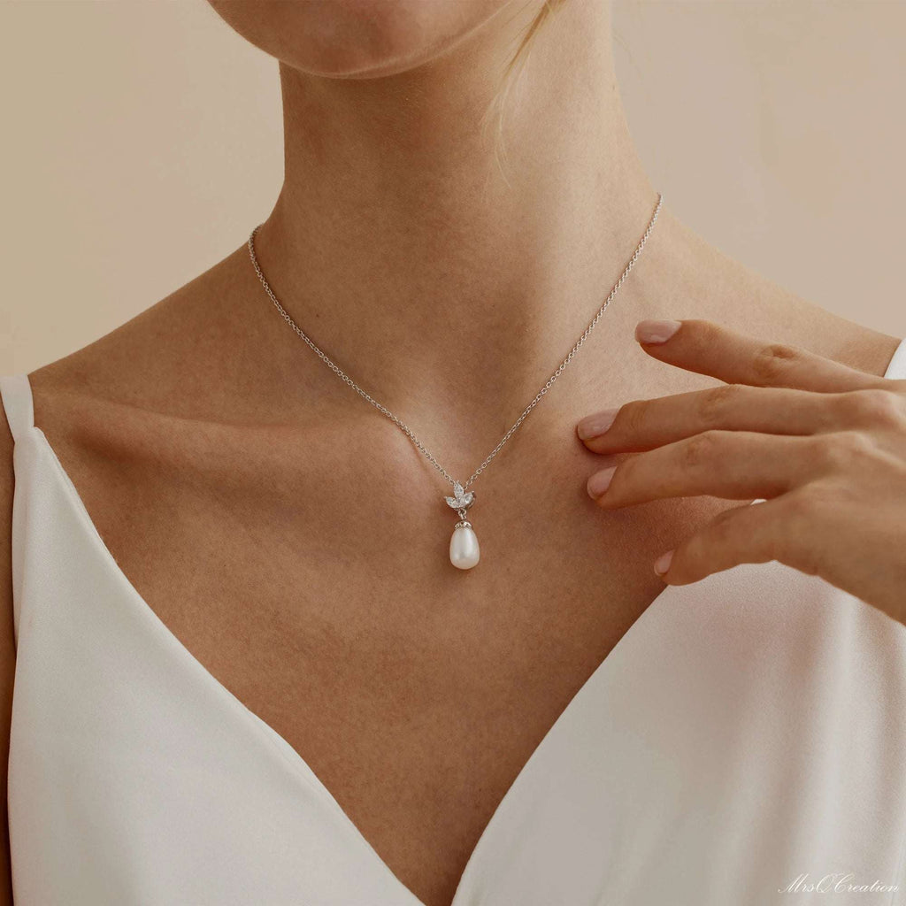 Eternal Pearl & Diamond Necklace – A Whisper of Elegance for Life’s MoGrace Woven in Crystal and PearlThe Eternal Pearl &amp; Diamond Necklace is where timeless beauty meets bridal elegance. Crafted in luminous sterling silver, it featRemoloxEternal Pearl & Diamond Necklace