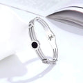 Timeless Edge stainless steel Roman numeral gear bangle for women with small gear details