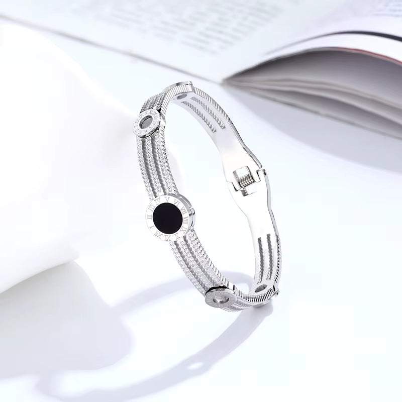 Timeless Edge stainless steel Roman numeral gear bangle for women with small gear details
