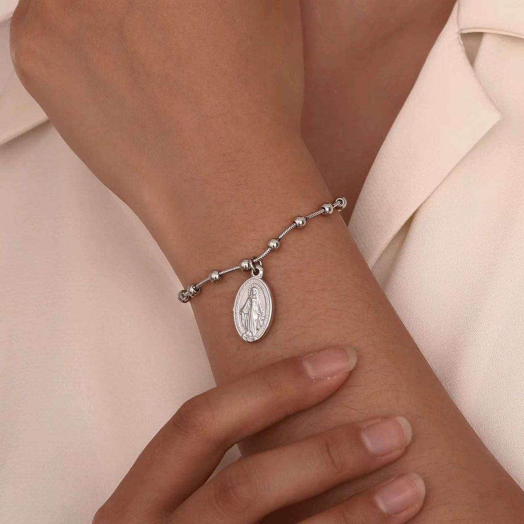 Divine Grace Rosary Bracelet – Faith Woven in Golden BeautyA Sacred Symbol, Elegantly WornThe Divine Grace Rosary Bracelet is a delicate fusion of devotion and style, thoughtfully designed for women and girls who carry theirRemoloxDivine Grace Rosary Bracelet